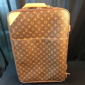 Original Louis Vuitton rolling carry-on luggage.